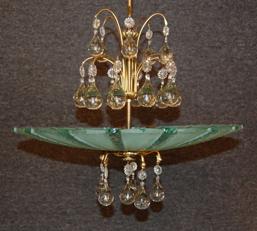 Gorgeous chandelier with handblown crystal teardrops and etched striped glass pendant bowl on a brass stem.  Designed by the famed glass house Orrefors c. 1950.<br />
<br />
Three 75 watt bulbs.<br />
<br />
Rewired to US standards.<br />
<br
