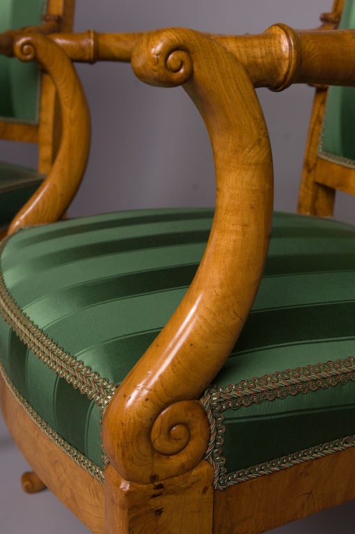 An important suite of four French Charles X period fauteuils, three of which were stamped, “J.J. WERNER”, by their maker, Jean-Jacques Werner.  These fauteuils were made from ash and burl ash with flat rectangular backs ornamented with three,