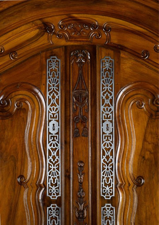An important, French, late 18th century, fruitwood, Provençal armoire with arched cornice from Arles, a lovely city and important center of beautiful Provençal furniture.  <br />
<br />
The armoire opens with two impressive doors, each having