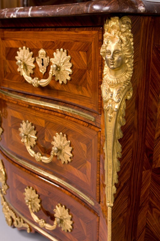 A fine French Louis XV period, marquetry commode galbée (curved) stamped, “MONDON”, by its maker François I Mondon (c. 1693-1775), on the front left panel.  The commode is made of “bois de violet” (tulipwood) and “bois de rose” (kingwood).  The