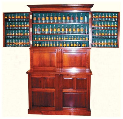 A superb pair of polished walnut ‘Bristol’ Dispensing Cabinets by Royal Warrant Holders Ferris & Co. Limited, Bristol, England, circa 1890. These Cabinets are thoroughly well made and finished in the best style of late 19th century furniture. They