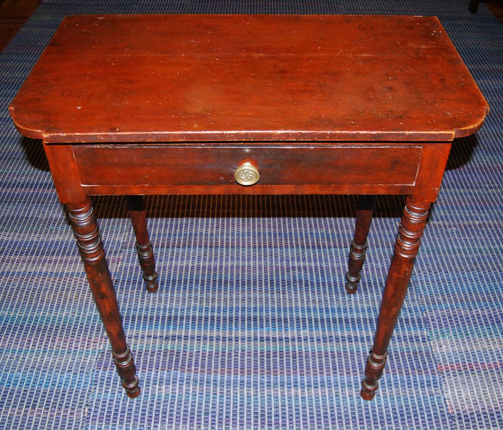 Sheraton one-drawer serving table with shaped top and turned legs, cherry wood; from North Shore, Massachusetts, circa 1830.