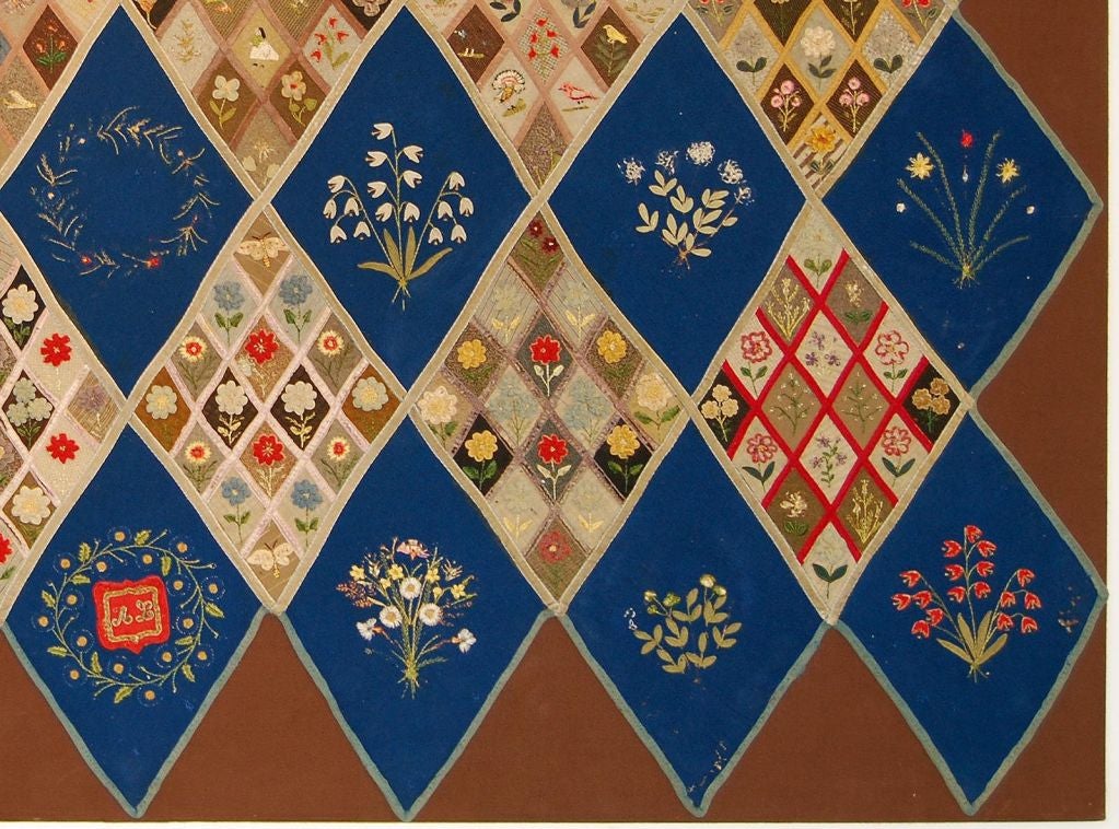 Outstanding appliqué and embroidered pictorial table rug, probably from New York State. Now professionally mounted on a stretcher with brown wool.