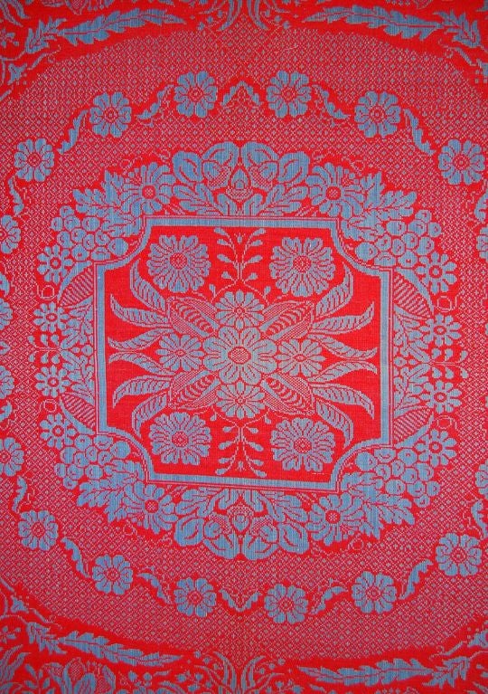 Bold jacquard coverlet from Pennsylvania, circa 1845, in red and slate blue