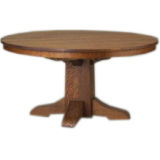 Large round dining table by Gustav Stickley