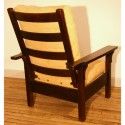 American fummed white oak. This chair is in its original medium dark finish.Beautiful selection of wood used by Gustav to create this chair. It's open arms give the chair a lighter less imposing look that will not overtake the room it's in.The chair