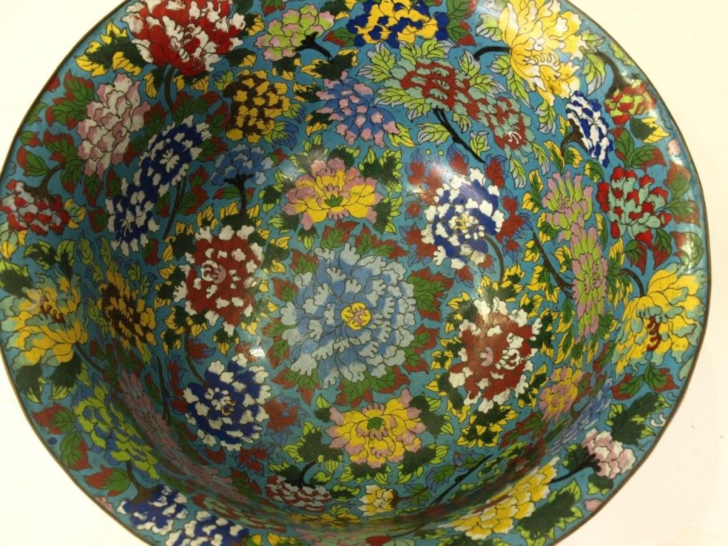 Large and impressive flared bowl w/overall multi-color floral pattern on blue ground.