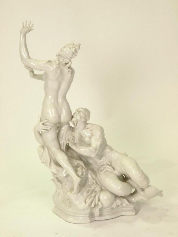 White porcelain sculpture depicting classical scene w/Neptune and female. Marks underneath base of unknown origin.