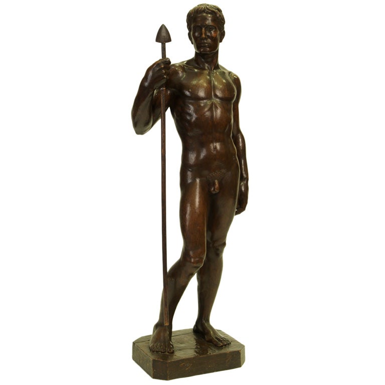 Carved figure of standing male by Wolfgang Grau