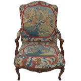 Needlework upholstered French walnut fauteuil a la reine
