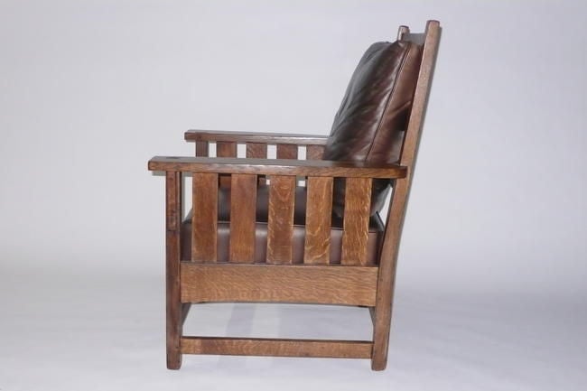 This is a very comfortable, very well designed armchair made in the style of Gustav Stickley around 1915.