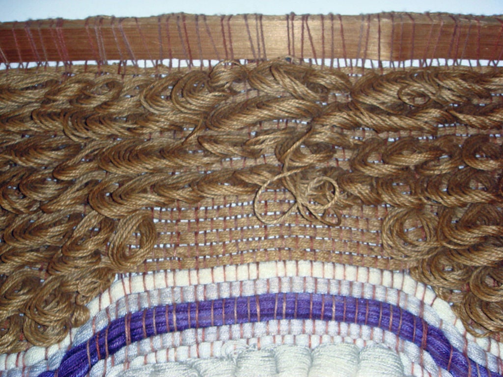 Richly textured hand woven surface in earthtones with purple accents. Reyna was Californis weaver and his work was included in several 