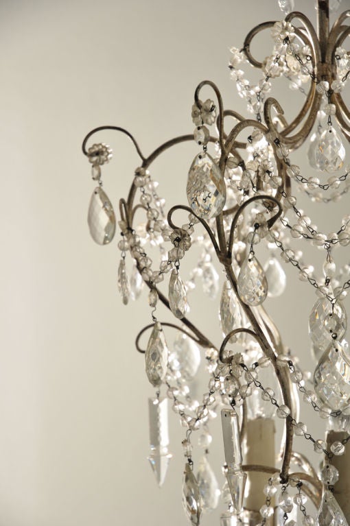 Extremely elegant chandelier draped with crystal beaded chain with three arm internal candelabra fixtures (electrified). A powerful statement anywhere it hangs. Included is a matching metal canopy.