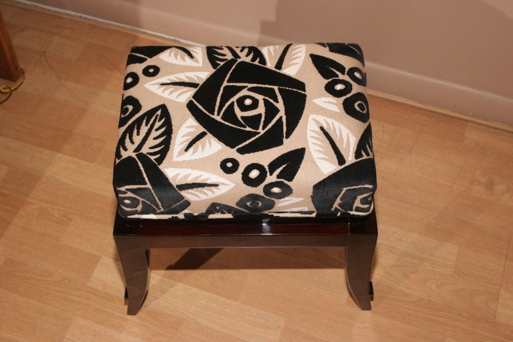 Art Deco pouf/tabouret attributed to Raphael. Macassar ebony frame with graciously tapered legs. Upholstered in vintage 