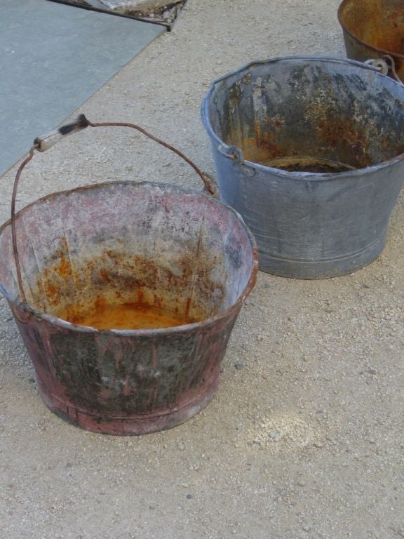 Vintage grape buckets with metal handles, some have a wooden grip. Various colors available. (Each sold separately).