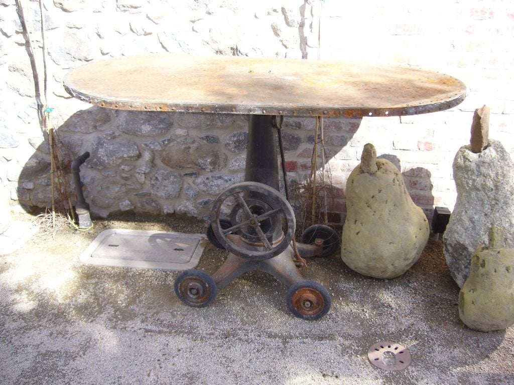 Oval riveted iron table.