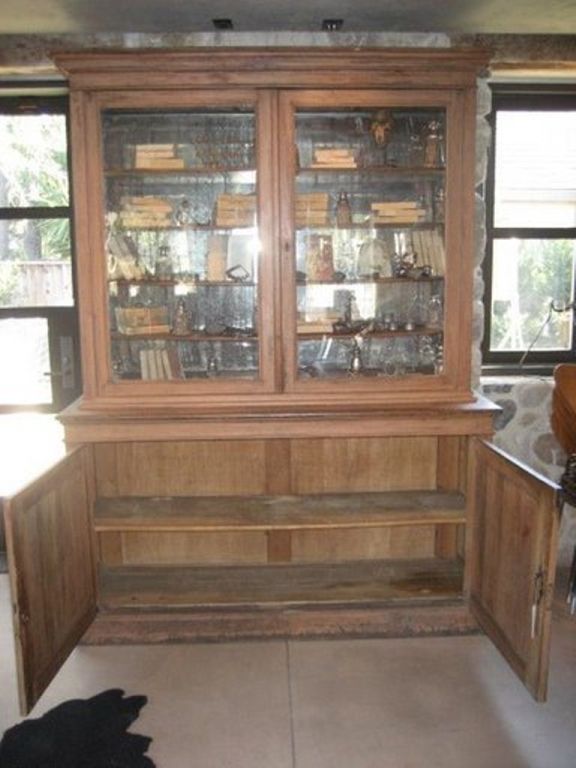 19th Century mirrored Vitrine or Bookcase with a great patina.  The top cabinet has four adjustable shelves with two glass doors that can be locked. Vintage condition.