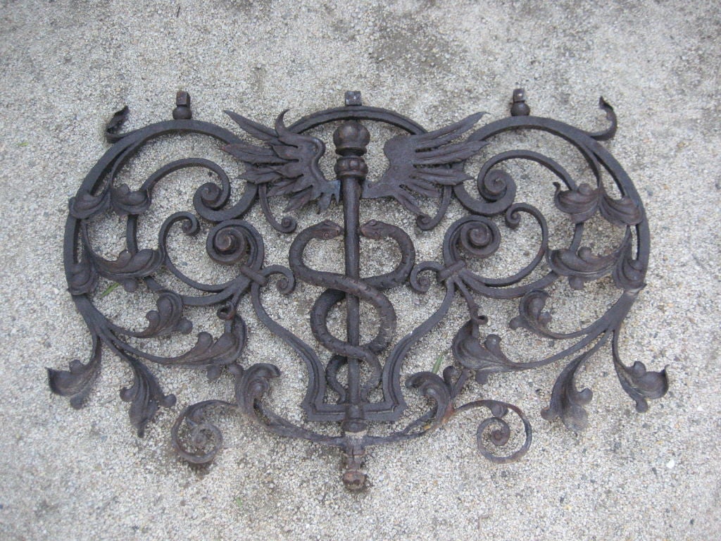 18th Century Apothecary sign was created with wrought iron, fer forge.  Beautiful details of the medical symbol of a winged staff with two snakes intertwined.