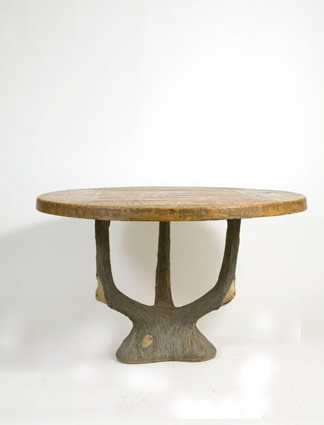 Early 20th century French faux bios cement table base with a contemporary faux bois fiberglass top.