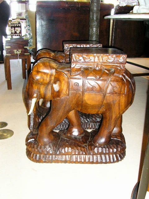 What is it about elephants that evoke the romantic? This pair of elephants, with their howdah seats, and carved details, conjure up the essence of an exotic era in a faraway place.