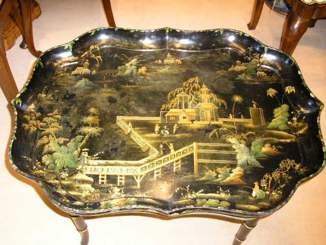 A rare signed 19th C, English tray on contemporary stand. The chinoiserie decorated tray is beautifully drawn and in excellent condition. Stamped on the reverse Clay, King St. Cov't Garden.