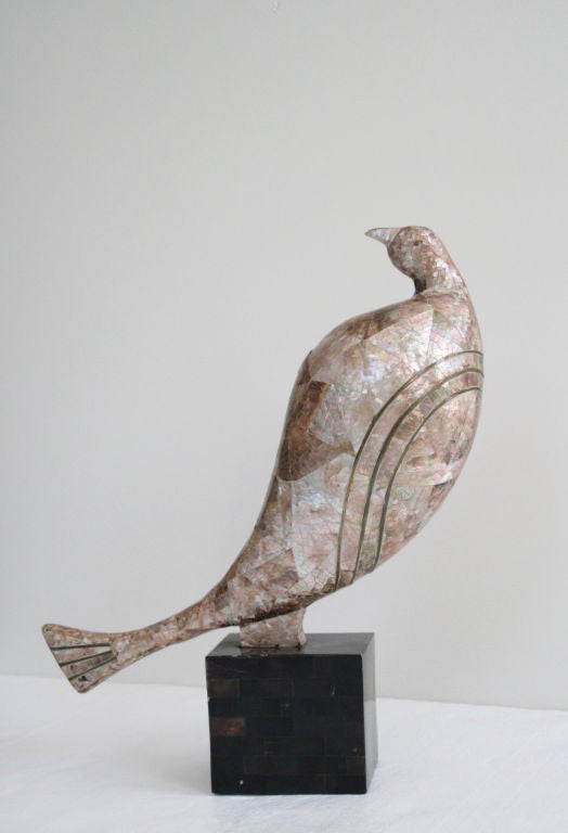 Mother of pearl partridge bird sculpture, 1970's. Covered in beautiful pink and white mosaic mother of pearl, with inlayed brass piping, on a tessellated horn base.