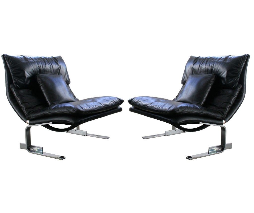 Pair of super sleek Sergio & Giorgio Saporiti leather Italian lounge chairs, Italy c. 1970's. Sleek curved backs with attached seat and back cushions, sits on solid chrome legs, with matching leather pillows. Newly reupholstered in black distressed