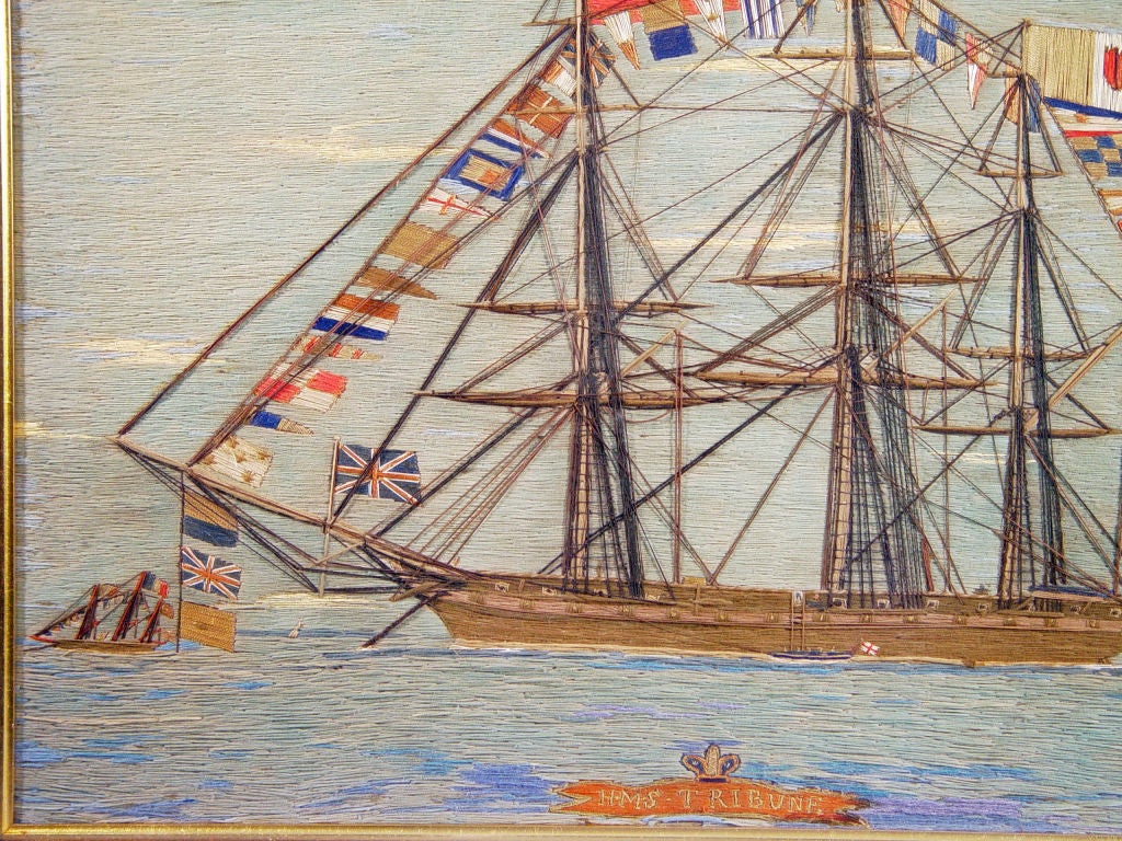 The woolie depicts H.M.S. Tribune at anchor and fully dressed.  Also with a Union Jack depicting that an Admiral is on board.  The Tribune flies three large flags from its masts- those of Turkey, France and Naples, Britain's main allies in its war