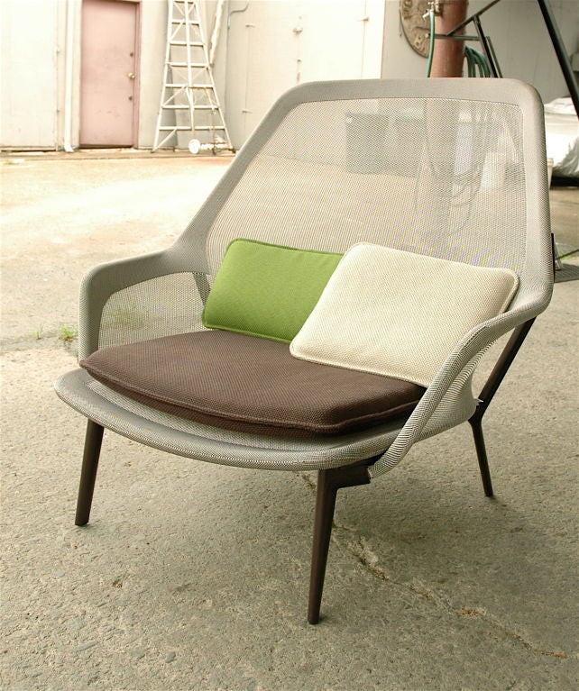 Lounge Chair known as the “Slow Chair.” Metal frame, Knit Fabric Mesh Seat, Aubergine Powder-Coated Aluminum Legs<br />
Generously proportioned armchair resulting from extremely strong and precisely shaped knit sling cover stretched over a metal