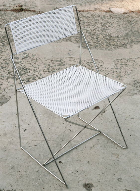 Set of four stackable dining chairs with perforated seat/back designed by Niels Jorgen Haugesen b.1936. Arne Jacobsen Design Partner, Teacher and winner of numerous designs awards-’63-‘89<br />
Two of the licensed chairs are Made in Italy by CM3V