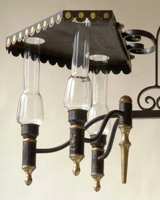 French An unusual Charles X style tole, brass, and iron chandelier