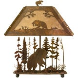 A Black forest style Arts and Crafts metal lamp
