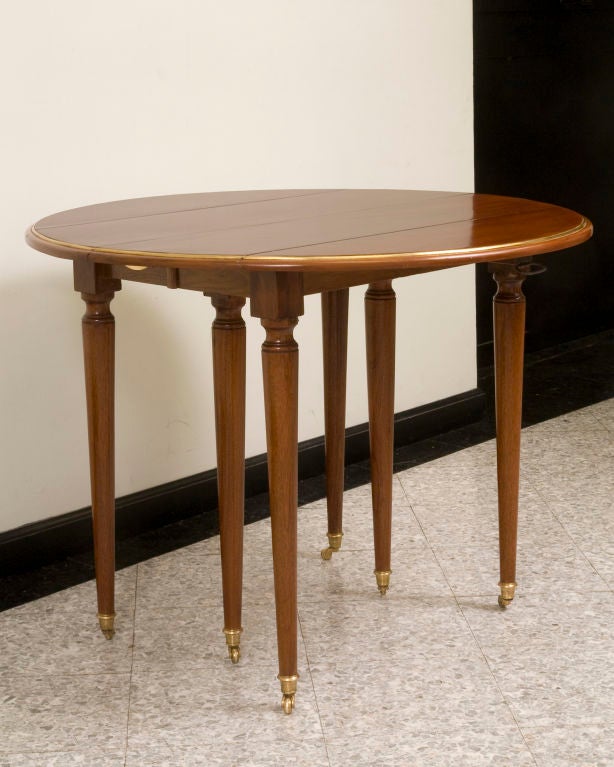 French Directoire Style Mahogany Dining Table with Brass Trim, Six Legs For Sale