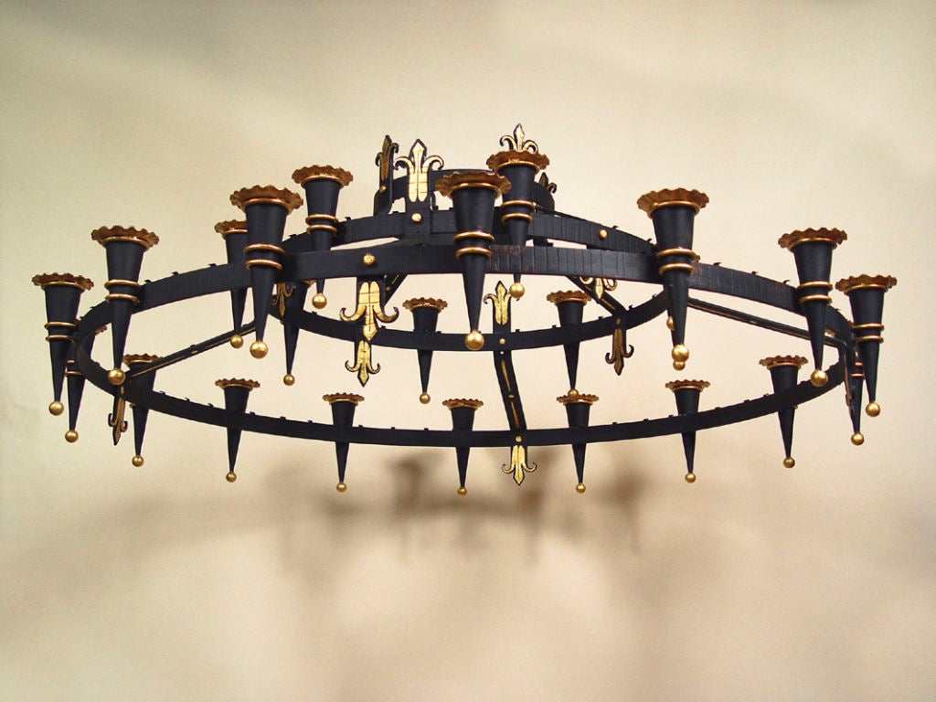 A large round black and partial gilt neo-Gothic chandelier, two tiers, (not wired)

Measures: Diameter 62