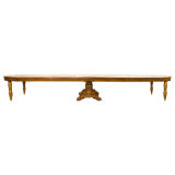 A French Restauration style walnut dining table with 8 leaves
