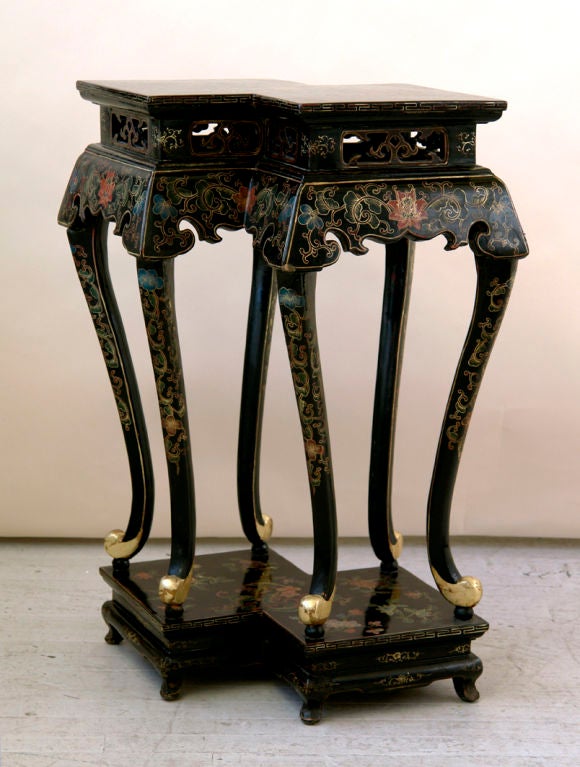 A black lacquer Chinese alter table with gilt and polychrome scrolling floral decoration, overlapping double square top with pierced apron supported by six curved legs on a raised platform base, width 27