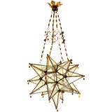 A tole and etched glass star shaped small lantern