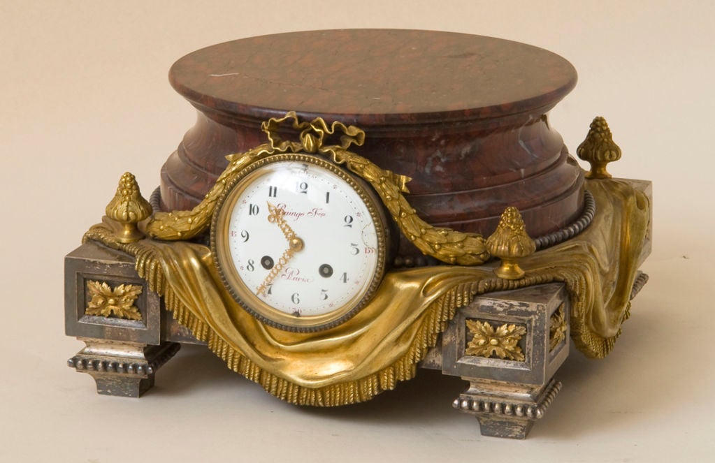 Red marble and gilt bronze clock