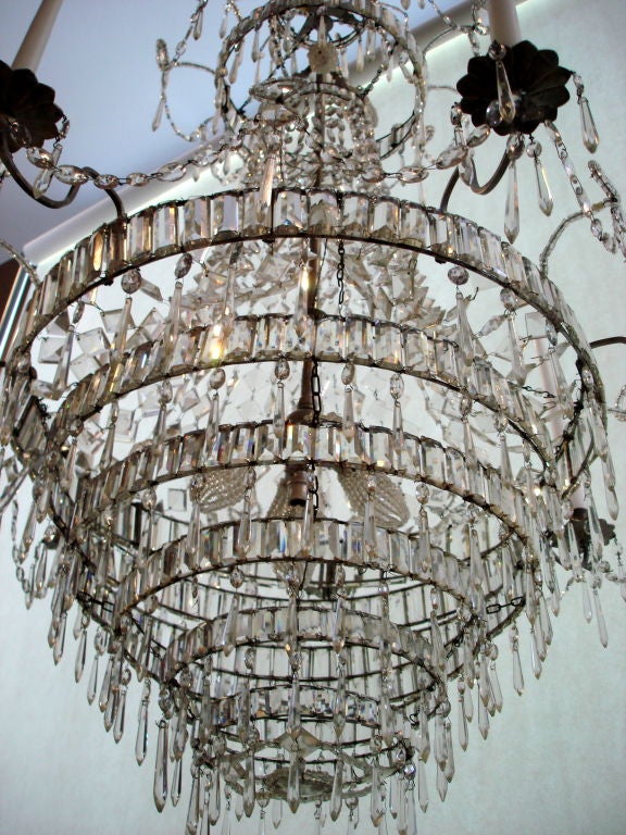 Impressive Period Swedish Neoclassical Chandelier.  Seven arms, double crown.  Internally wired for electricity and arms with actual candles for dual use.  Arms can be French wired if desired.