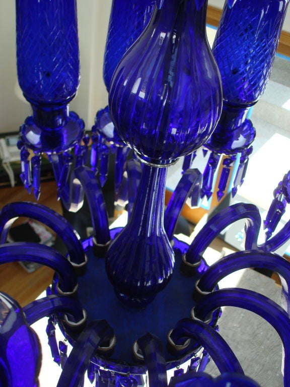 Rare and Stylish Twelve Arm Cobalt Blue Chandelier placed by Sister Parish in the Ritz Carlton Hotel, Boston, MA, in the 1960's.  Cobalt Blue shades, wired.  Bristol glass.