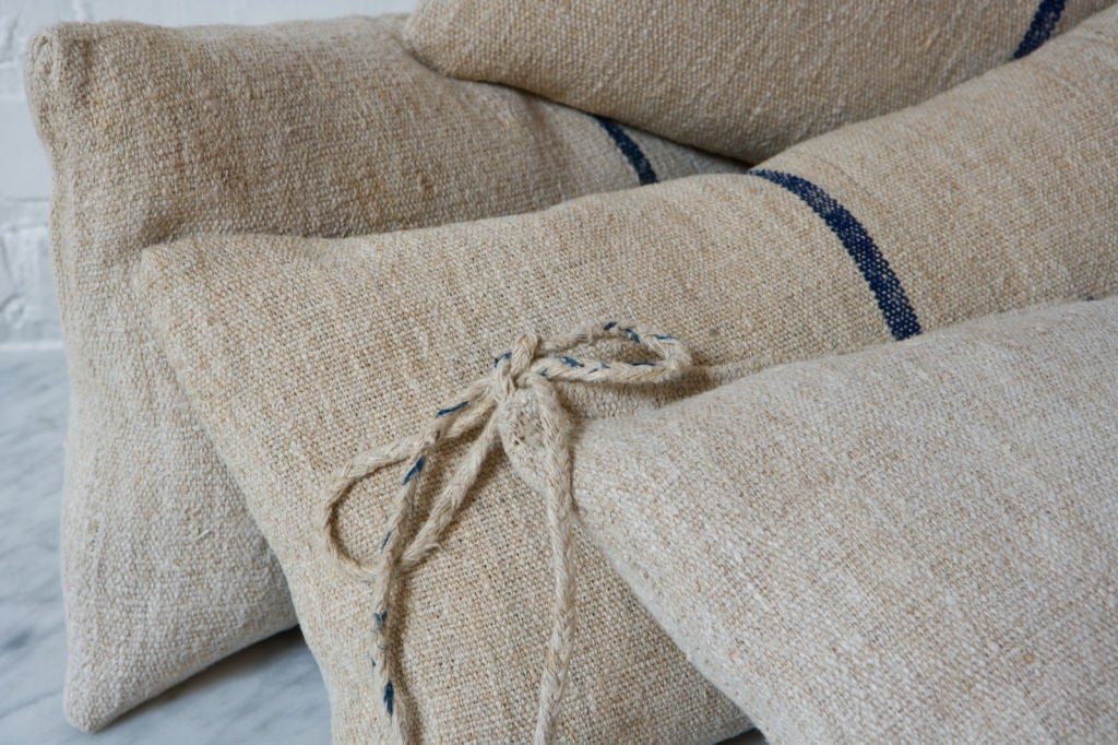 Custom pillows using vintage grainbags. Down/feather inserts. Lovely natural color with dark indigo single stripe.  Pillows priced separately.<br />
<br />
Photographs  John Granen