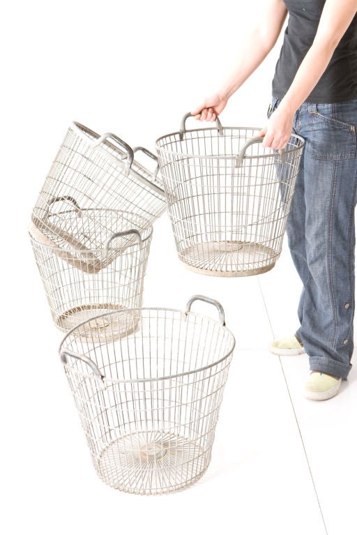 Fabulous metal baskets that are as functional as they are cool to look at. Store toys, firewood, or rolled towels in a bathroom, you can use them for anything... anywhere! Priced separately.    <br />
<br />
Photographs  John Granen