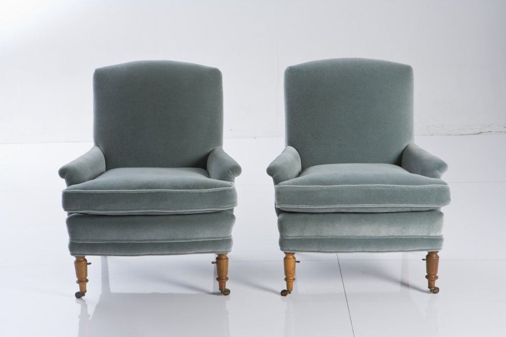 Amazing pair of chairs and matching ottoman. Completely rebuilt and upholstered in a gorgeous and very soft mohair. Legs and have been cleaned and waxed and all original hardware remains. New custom down and feather cushions. <br />
Perfect in