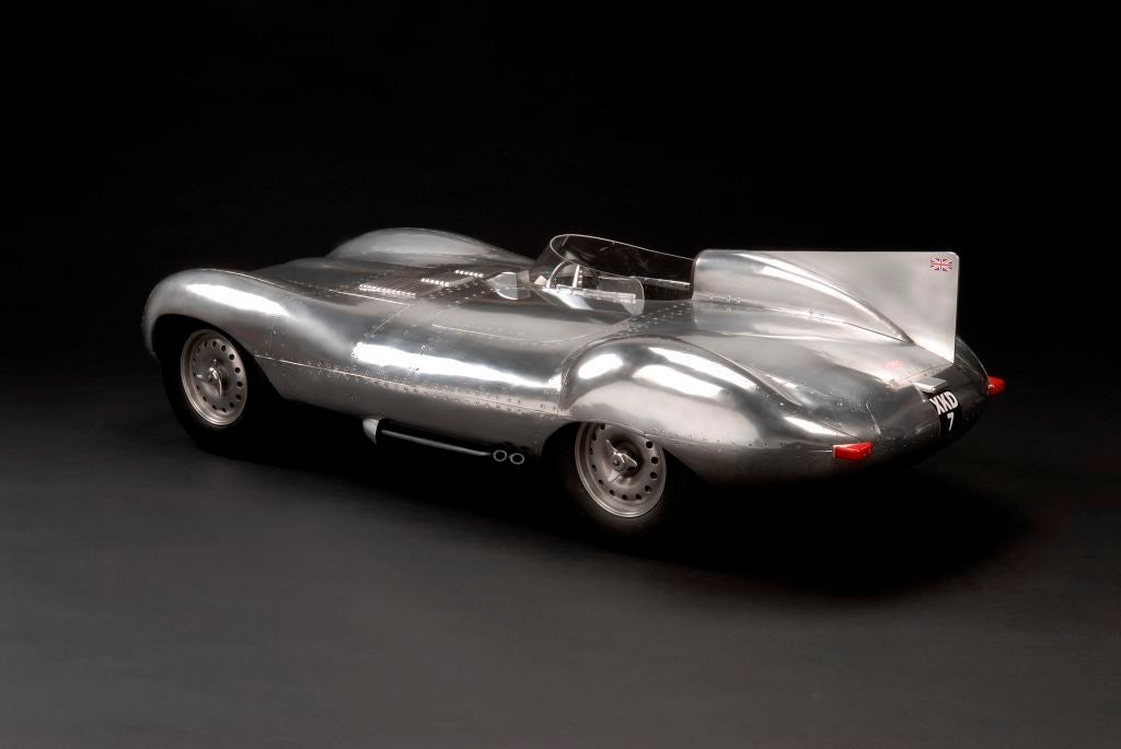 A magnificent and unique large-scale aluminium model of a shortnose Jaguar D-Type racing car, complete with fin, registration number XKD7, made in Elwell’s signature style of hand formed aluminium panels riveted over a space frame, the cast