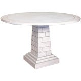 Painted pedestal table with brickwork base.