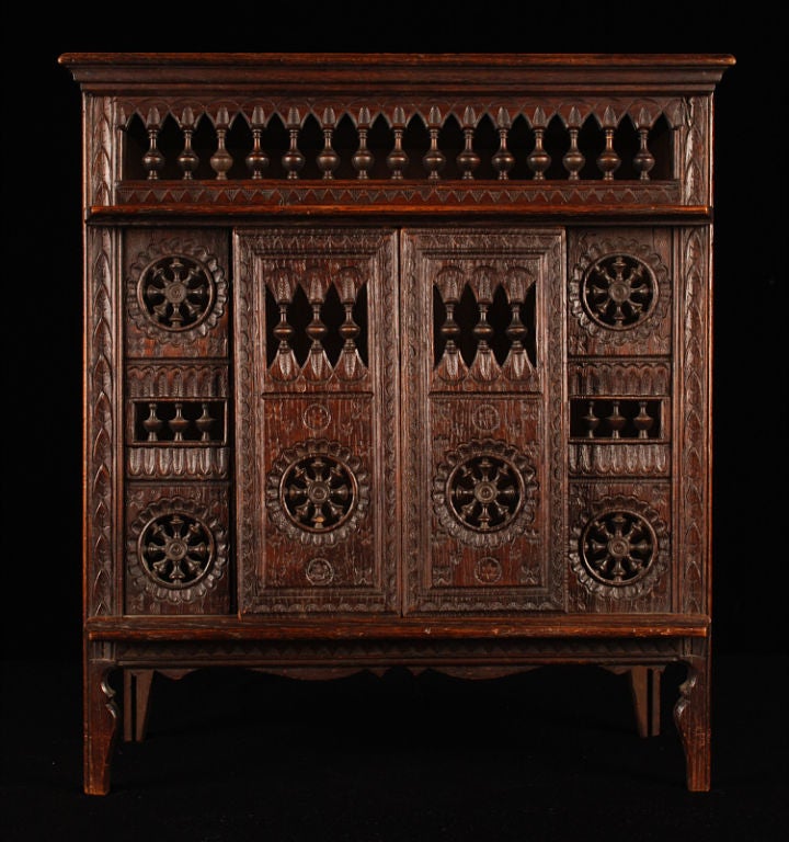 This another fine example of the splendid and petite vintage furniture from the Brittany region of France. Wonderfully carved in every detail, this miniature piece is of a Brittany Closed Bed also used as cupboard or for storage. The four front