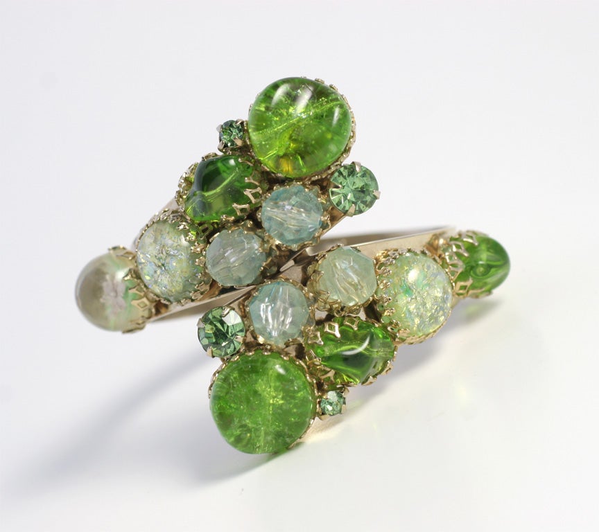 Prong-set green glass stones on clamped bracelet