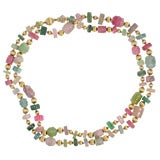 Exceptionally carved multi-colored tourmaline and gold necklace.