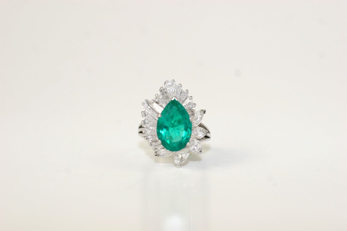 Pear Shape Columbian emerald dinner ring center emerald 4.24 carats,  17 tapered baguettes 1.75 5 marquise cut diamonds 2.00