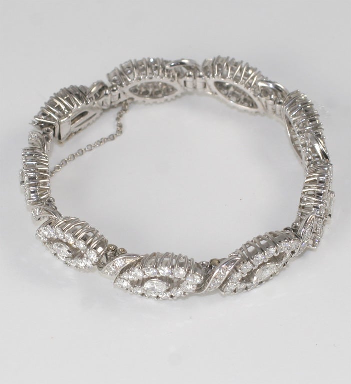 18kt White Gold  & Diamond Bracelet.  Alternating links, each set with a center Marquise Diamond & surrounded by full cut clean, white Diamonds. & interspersed with ribbon like, diamond set elements.  Total weight - approximately 17cts.